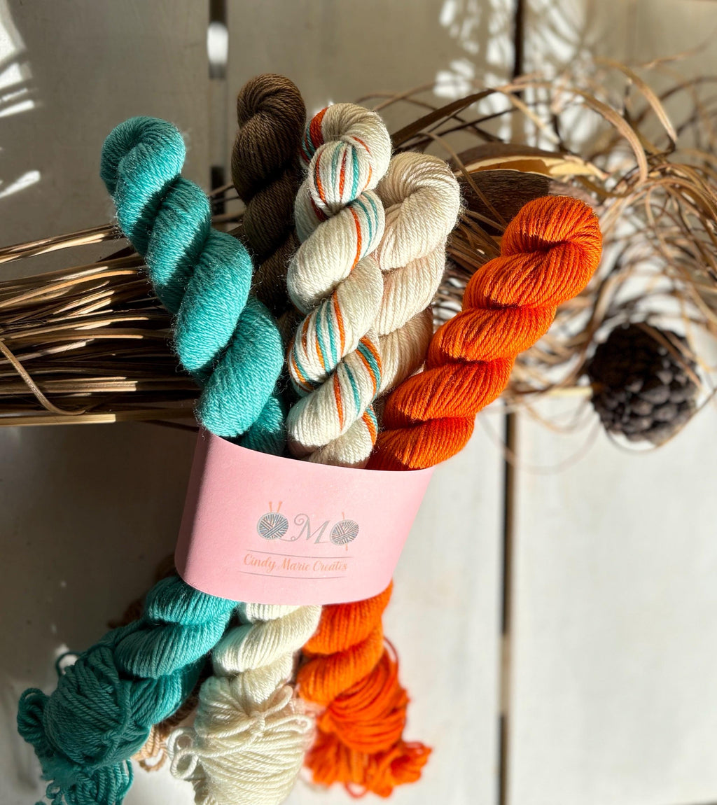 Feathers & Flowers, a merino, hand dyed yarn soft natural beige, saffron orange, teal green