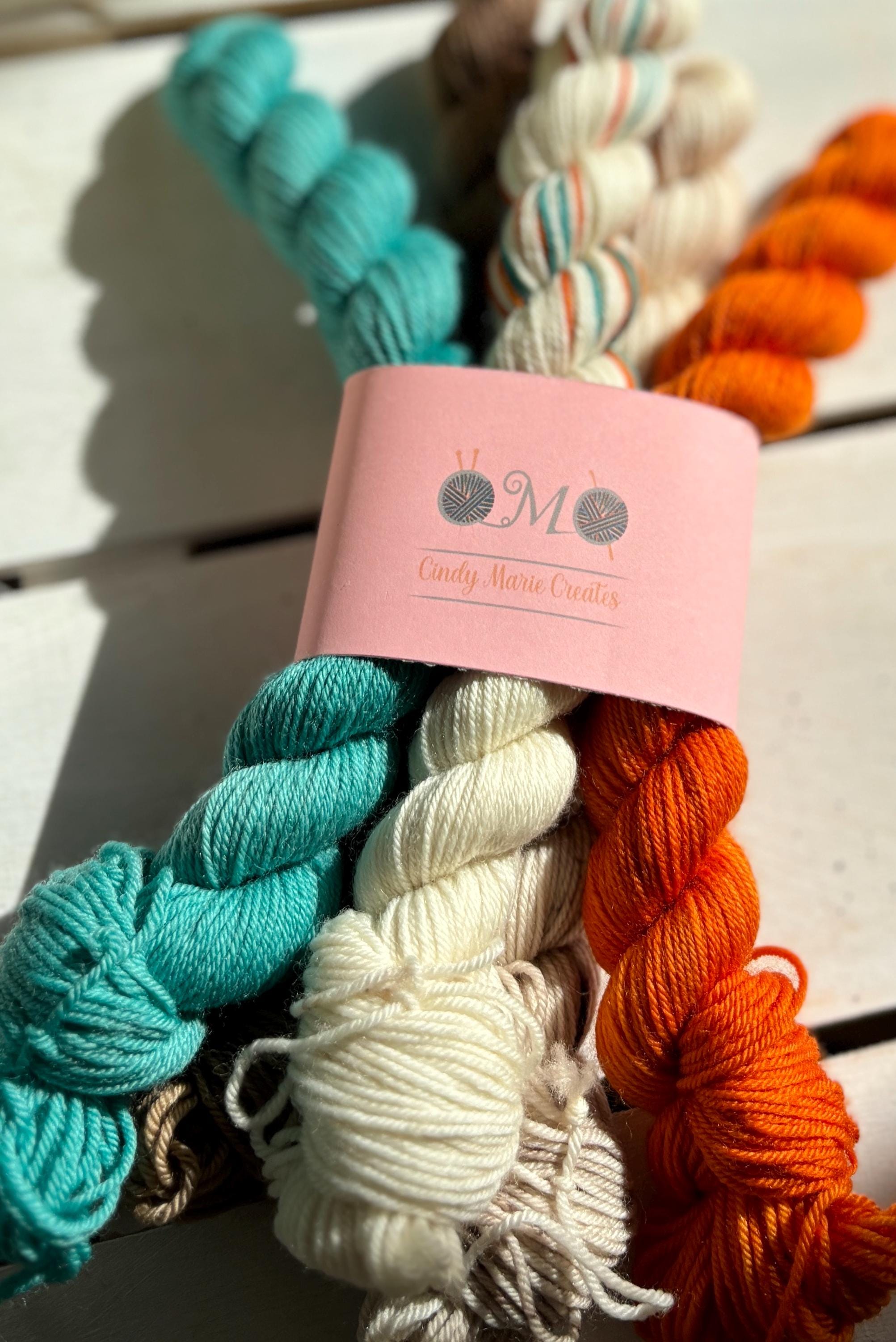 Feathers & Flowers, a merino, hand dyed yarn soft natural beige, saffron orange, teal green