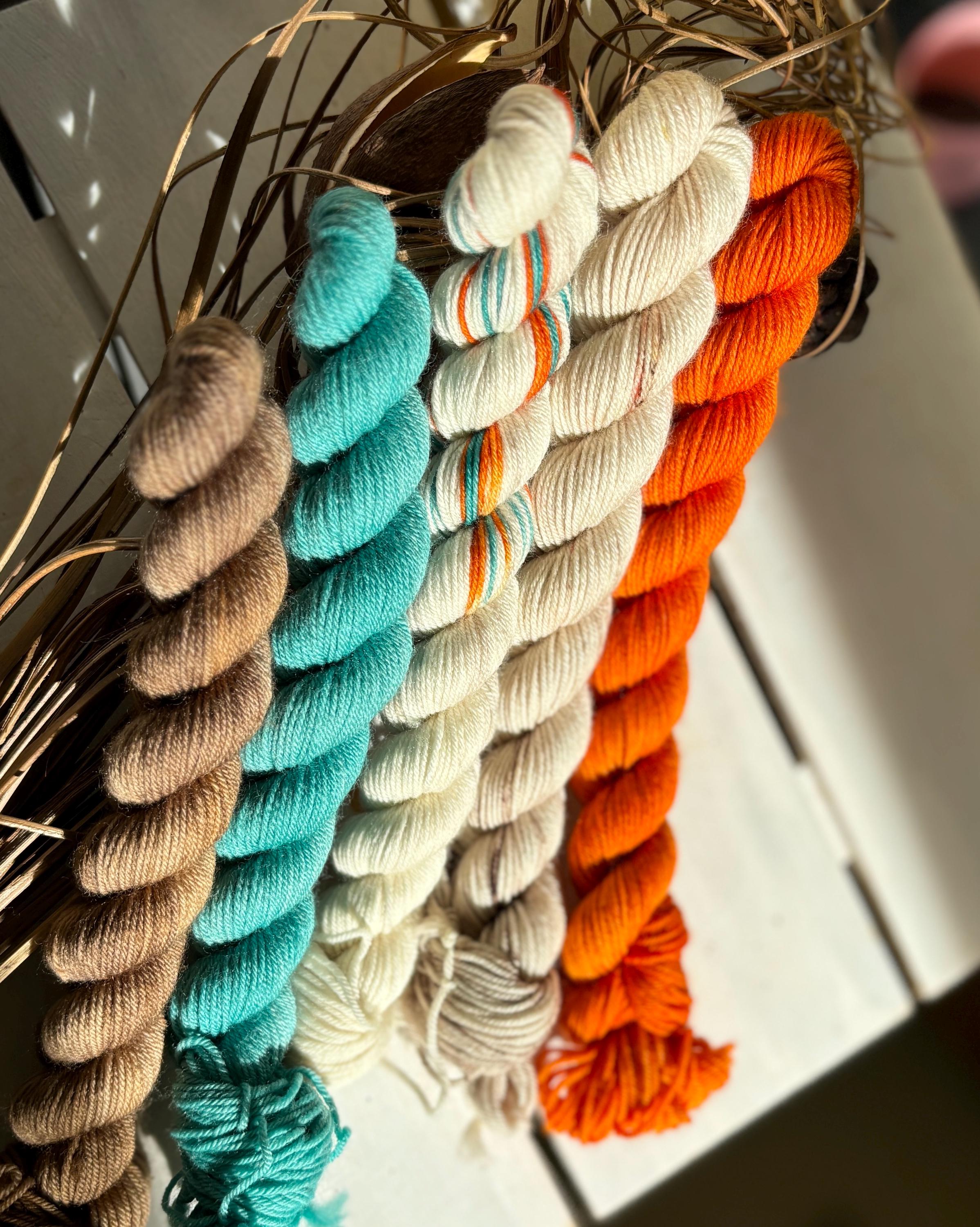 Feathers & Flowers, a merino, hand dyed yarn soft natural beige, saffron orange, teal green