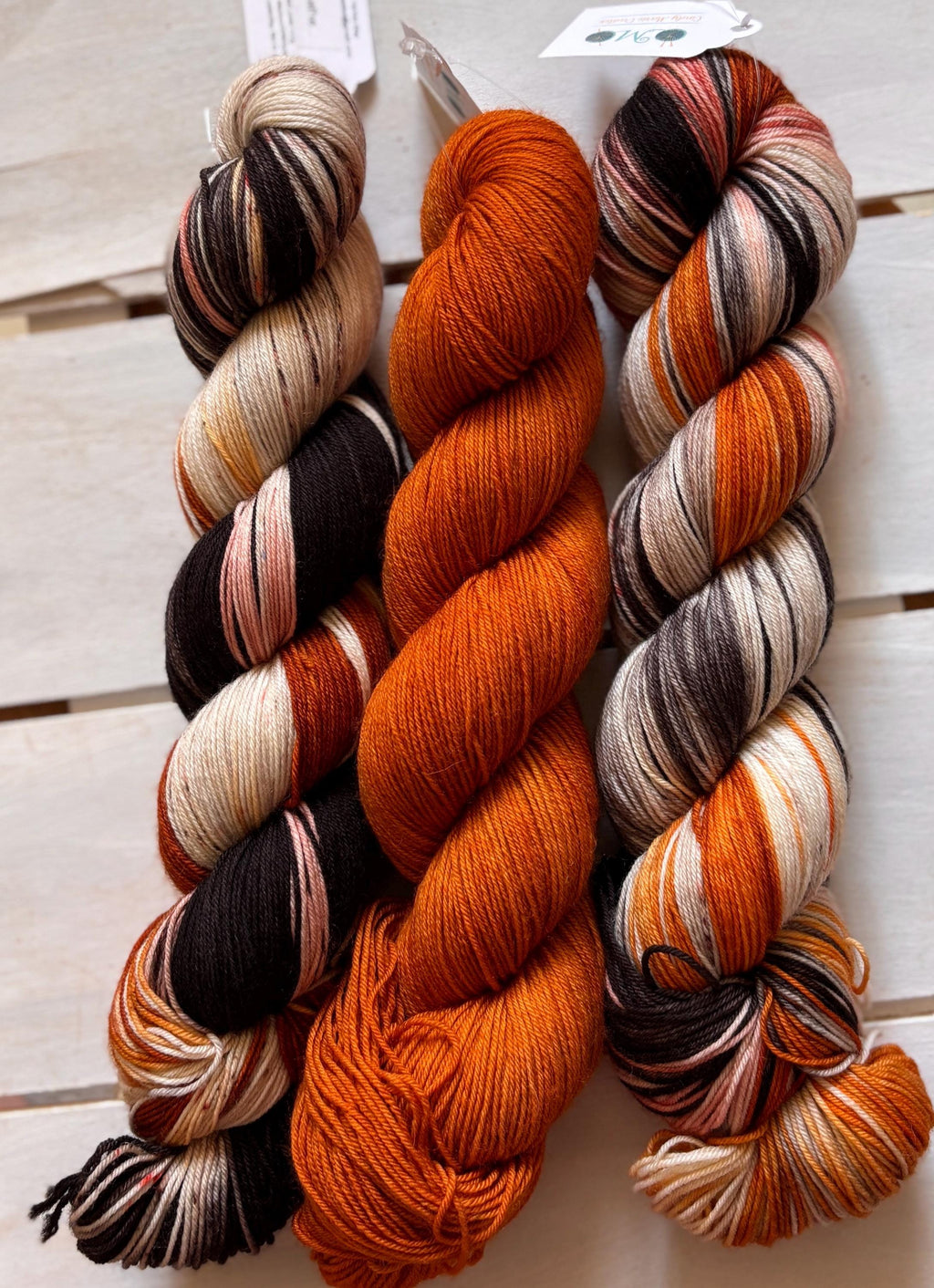 Just Breathe, dark brown, black, peach, 75/25 merino superwash wool