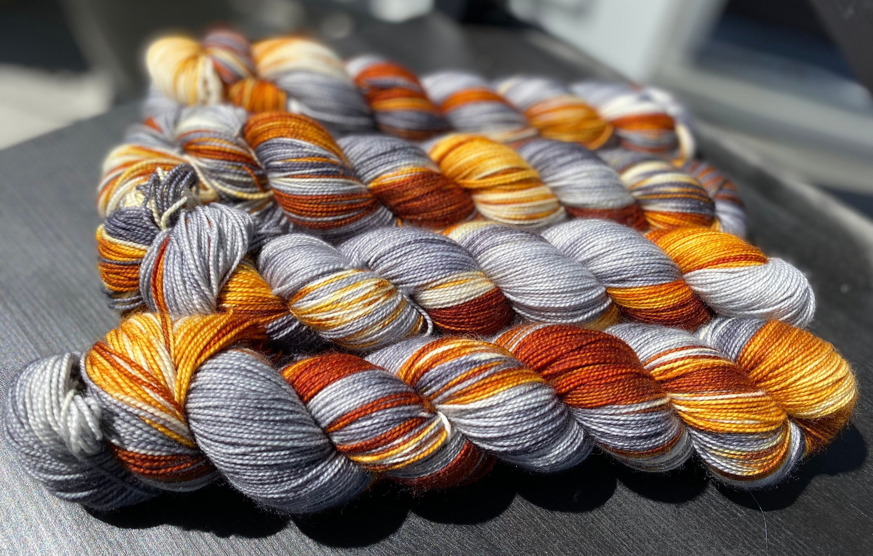 Foxy Lady, brown, golden honey, silver, grey, dark grey, Fingering,  463 yrds/100 grams. Yarn