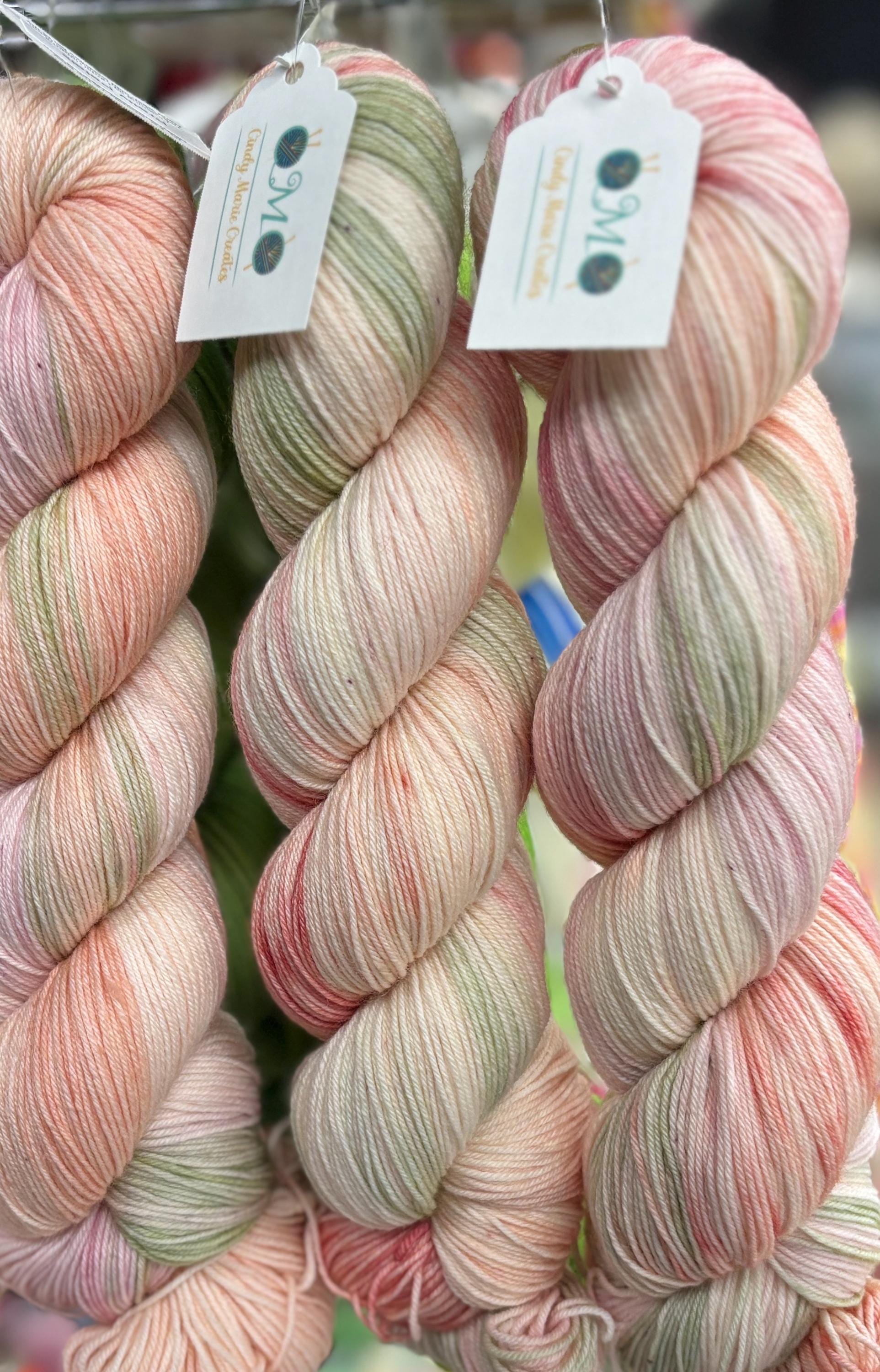 Pretty Petals, peach pink with a soft sage green,DK and fingering