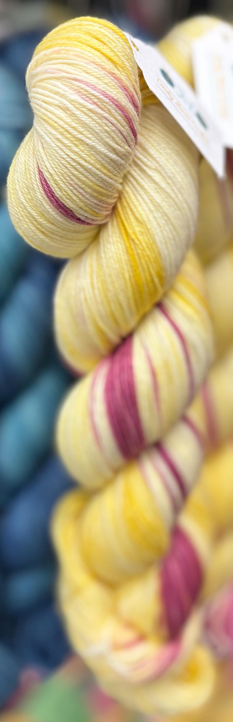 Sunshine Meadow, soft yellow with warm deep pink DK and fingering