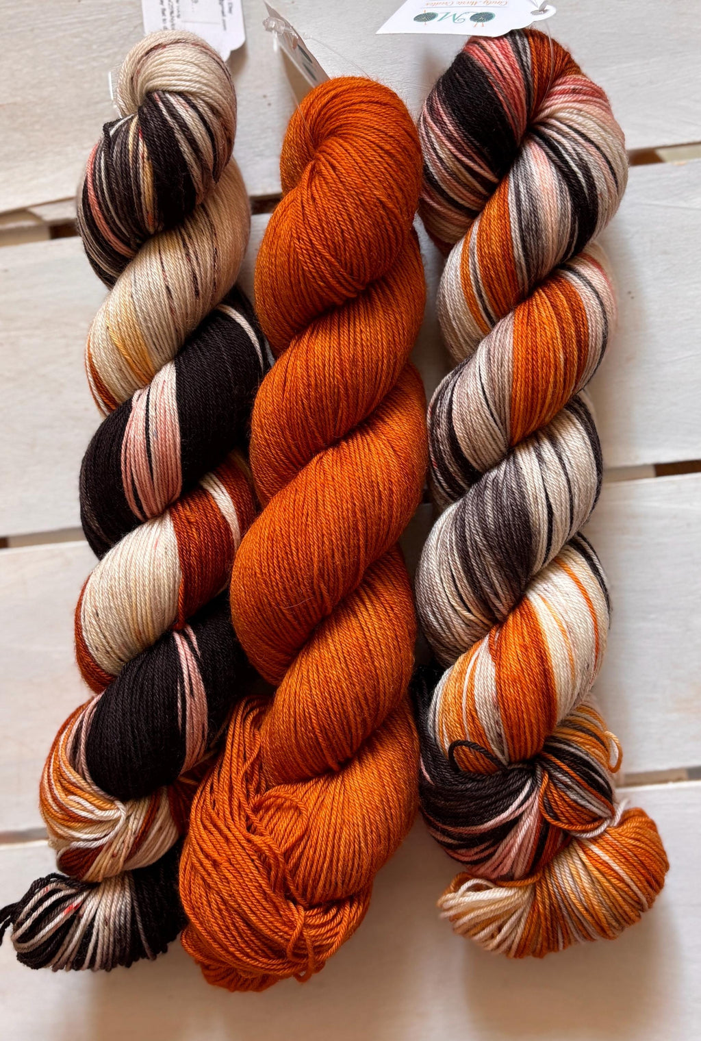 Just Breathe, dark brown, black, peach, 75/25 merino superwash wool