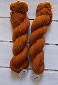 Rust a deep dark burnt orange, merino nylon wool, DK and fingering