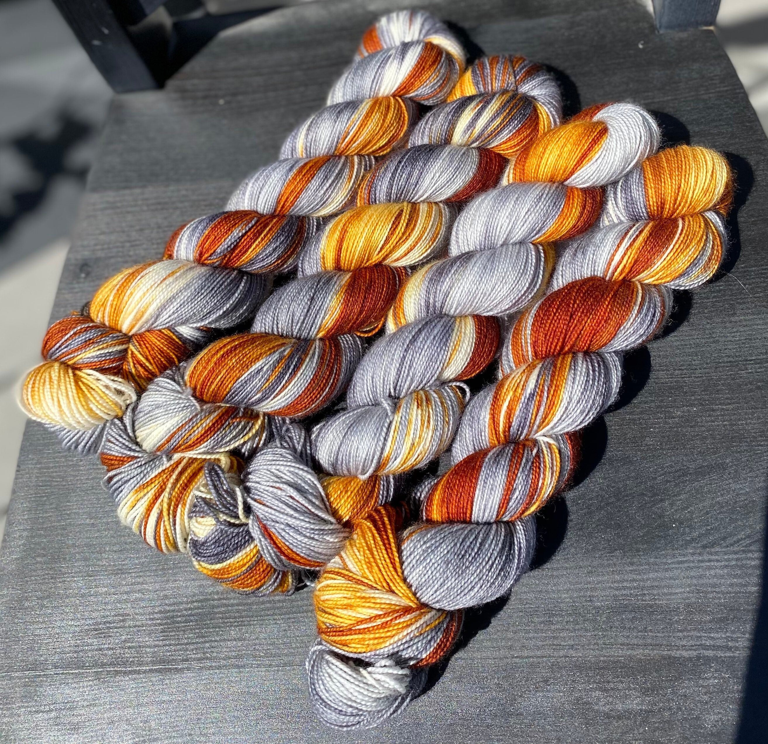 Foxy Lady, brown, golden honey, silver, grey, dark grey, Fingering,  463 yrds/100 grams. Yarn