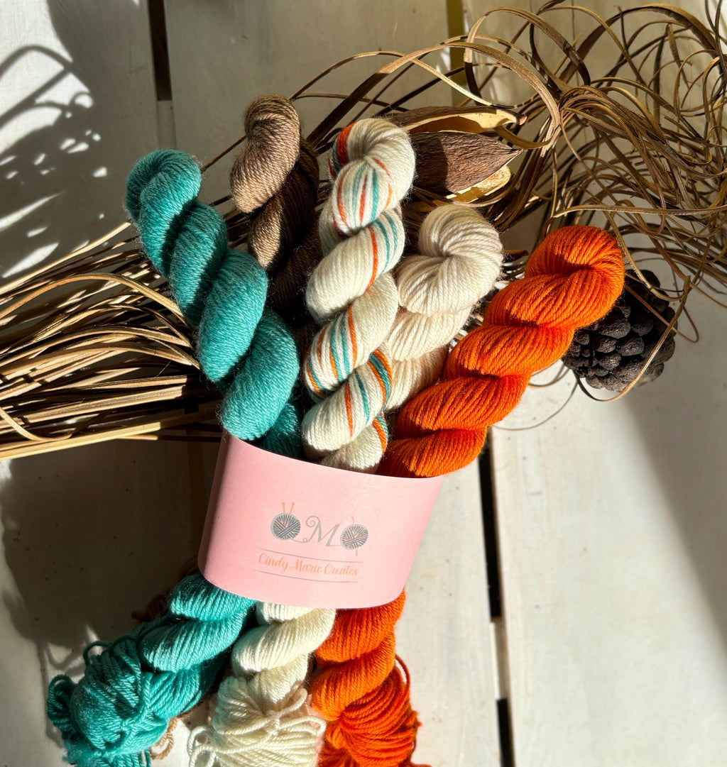 Feathers & Flowers, a merino, hand dyed yarn soft natural beige, saffron orange, teal green