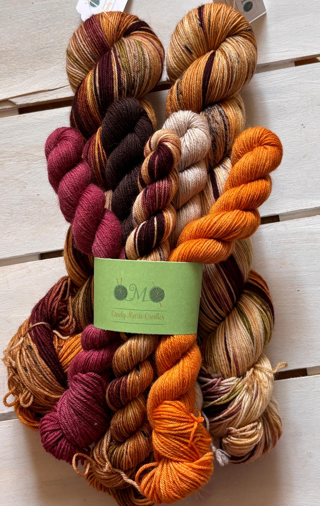 Fern Gully brown, beige, green, maroon, 75/25 merino superwash wool