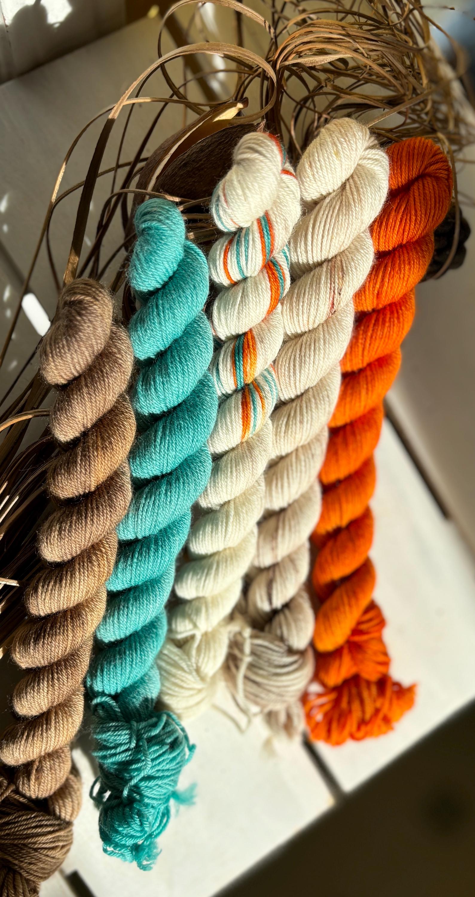 Feathers & Flowers, a merino, hand dyed yarn soft natural beige, saffron orange, teal green